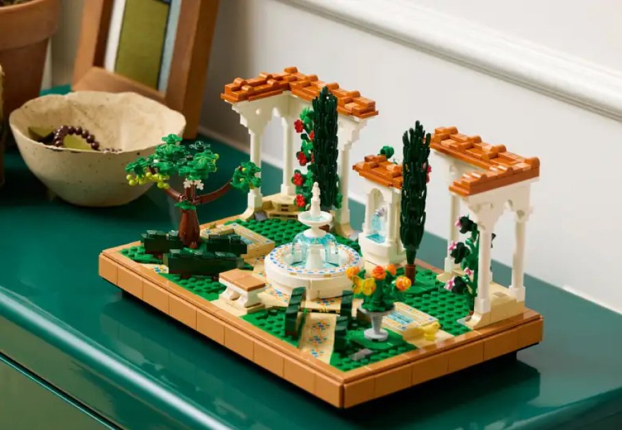 Imagen de un set de lego de un jardin con un estanque en el centro